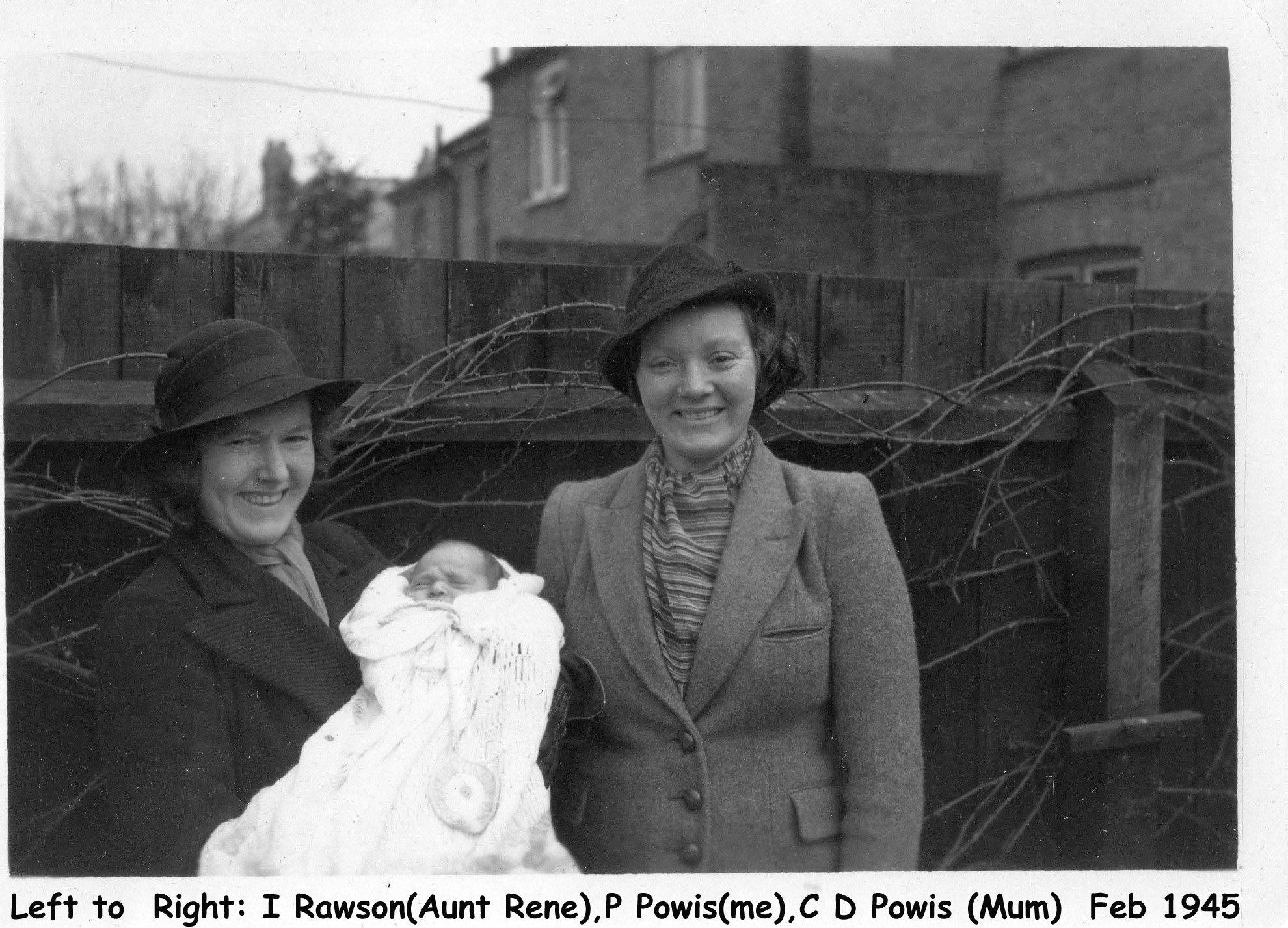 Two women holding a baby