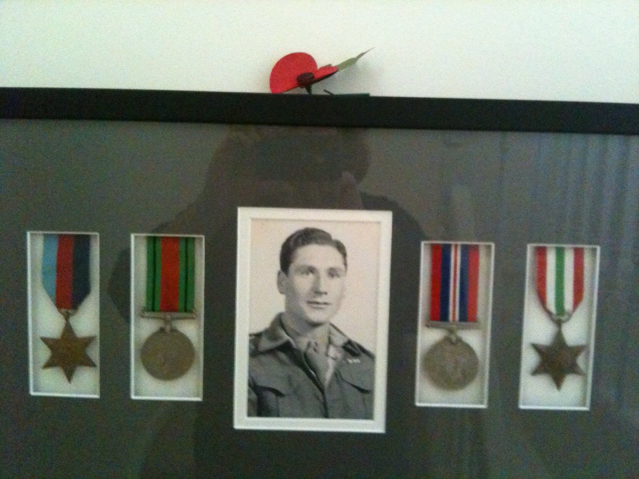 Medals and photo of Ben Sawyer