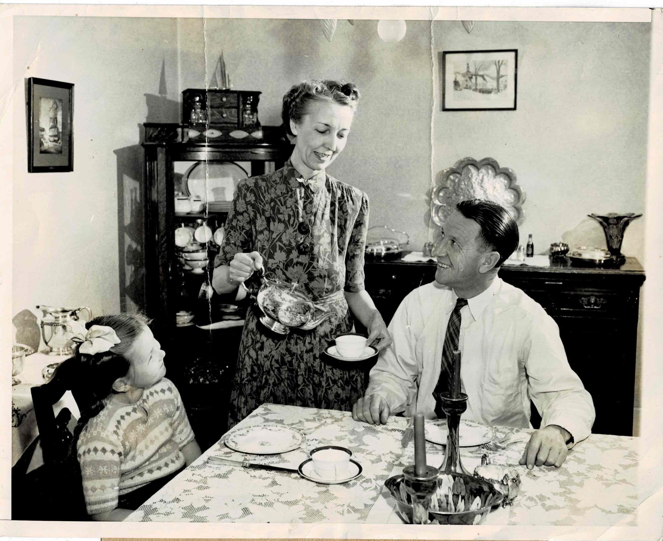 Ada serves tea to Duke Schiller while Barbara Jane watches