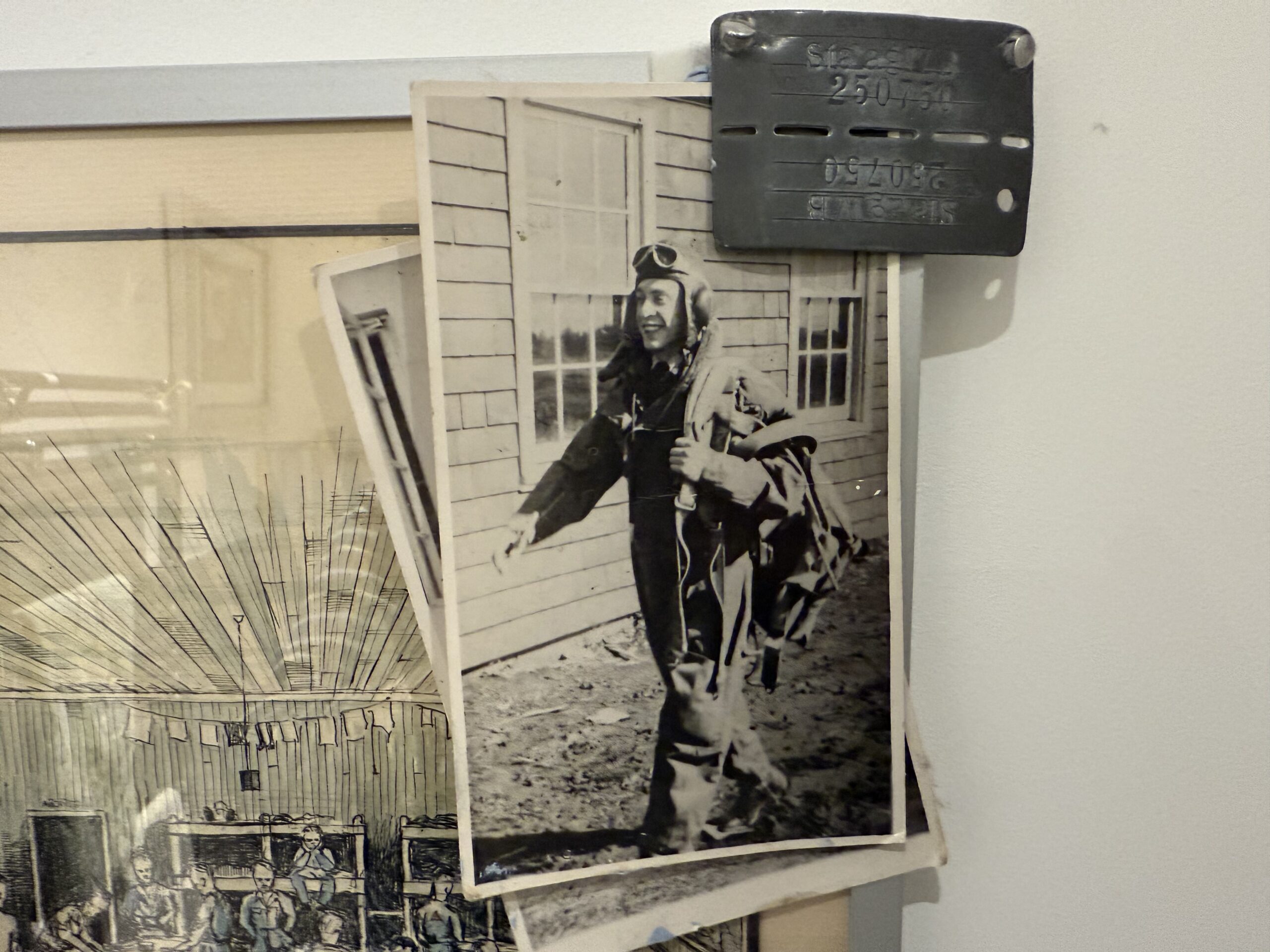 Photographs, drawings and a dog tag